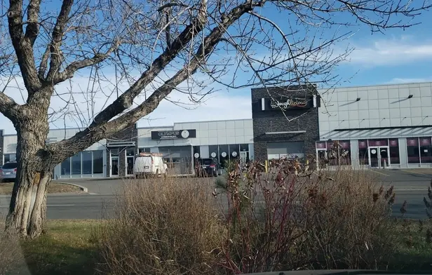 A photograph of the main exterior of the Islamic Information Society of Calgary (IISC), showcasing its architecture as a central place of worship, Islamic education, and community gathering for Muslims in Calgary.
