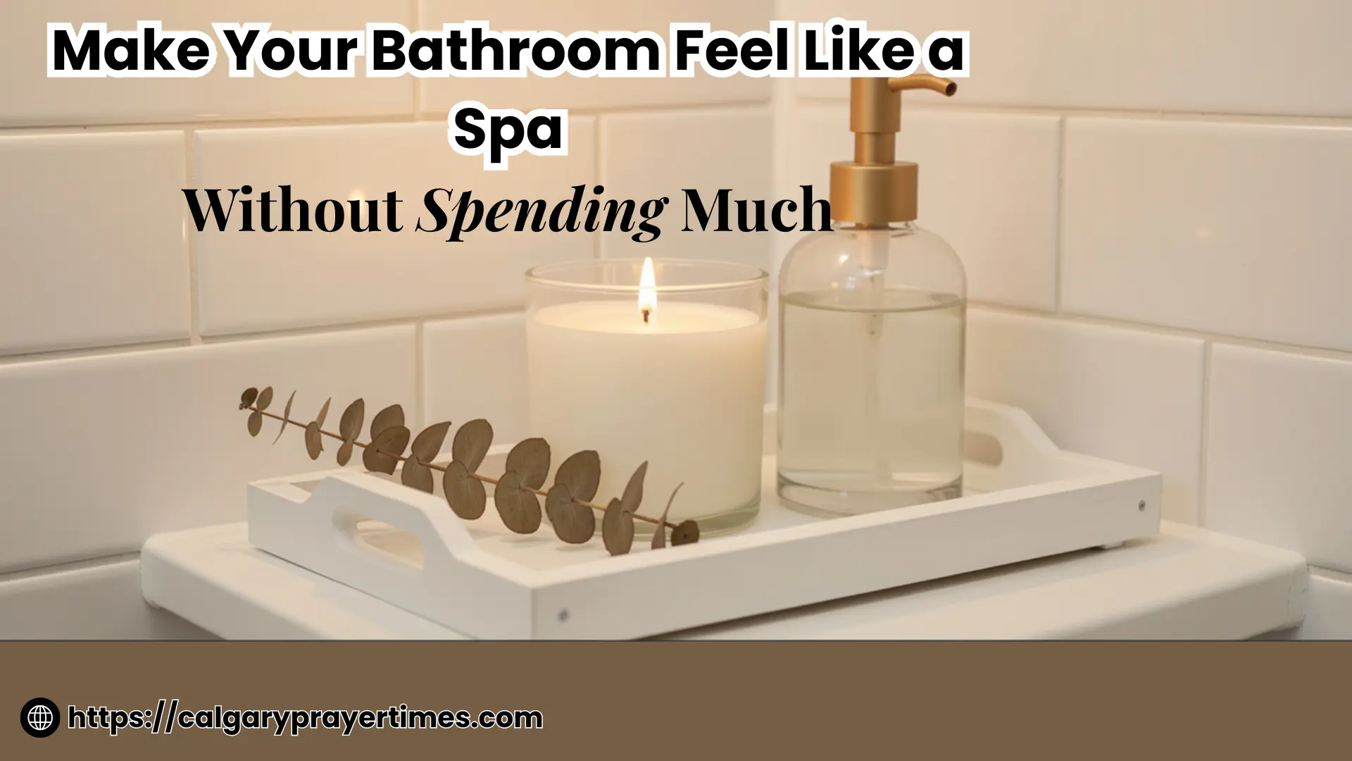 A serene spa-like bathroom with white folded towels, a lit candle, a small plant, and warm lighting